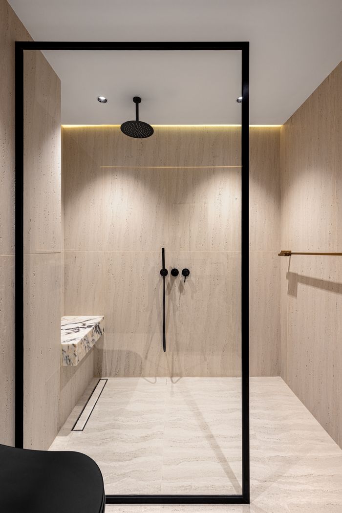 Crafting Captivating Headlines: Your awesome post title goes here Sleek walk-in shower with light wood textures and modern fixtures.